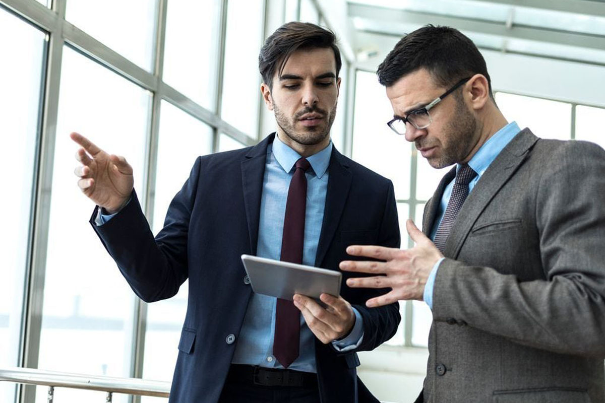 Two business men looking at a tablet